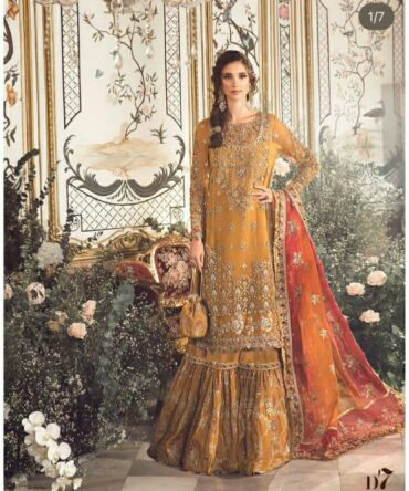 "Introducing Maria B Wedding Collection 2024 – a breathtaking ensemble of meticulously crafted wedding wear. The collection features exquisite details, including Organza embroidered front panels, spangle work borders, hand embellished sleeves, tie & die dupatta, and more. Elevate your bridal elegance with this stunning assortment."